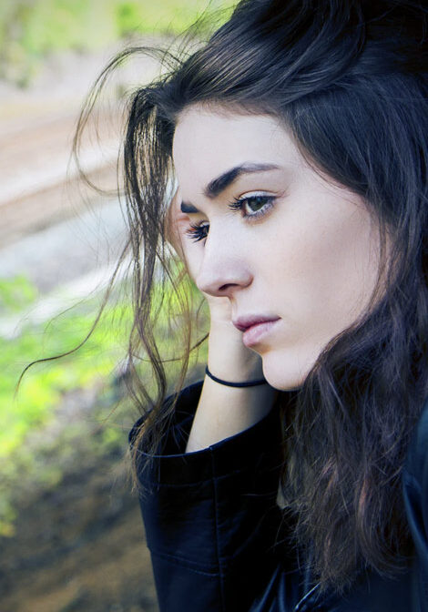 Young girl looks sad